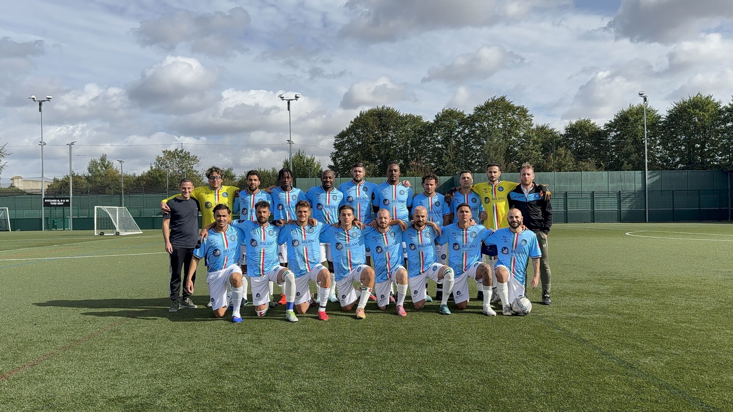 The Royal Parthenope FC squad posing on the pitch in the sky blue 2026/27 kit